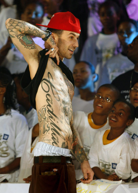Travis Barker shows off his Cadillac tattoo at the Third Annual General